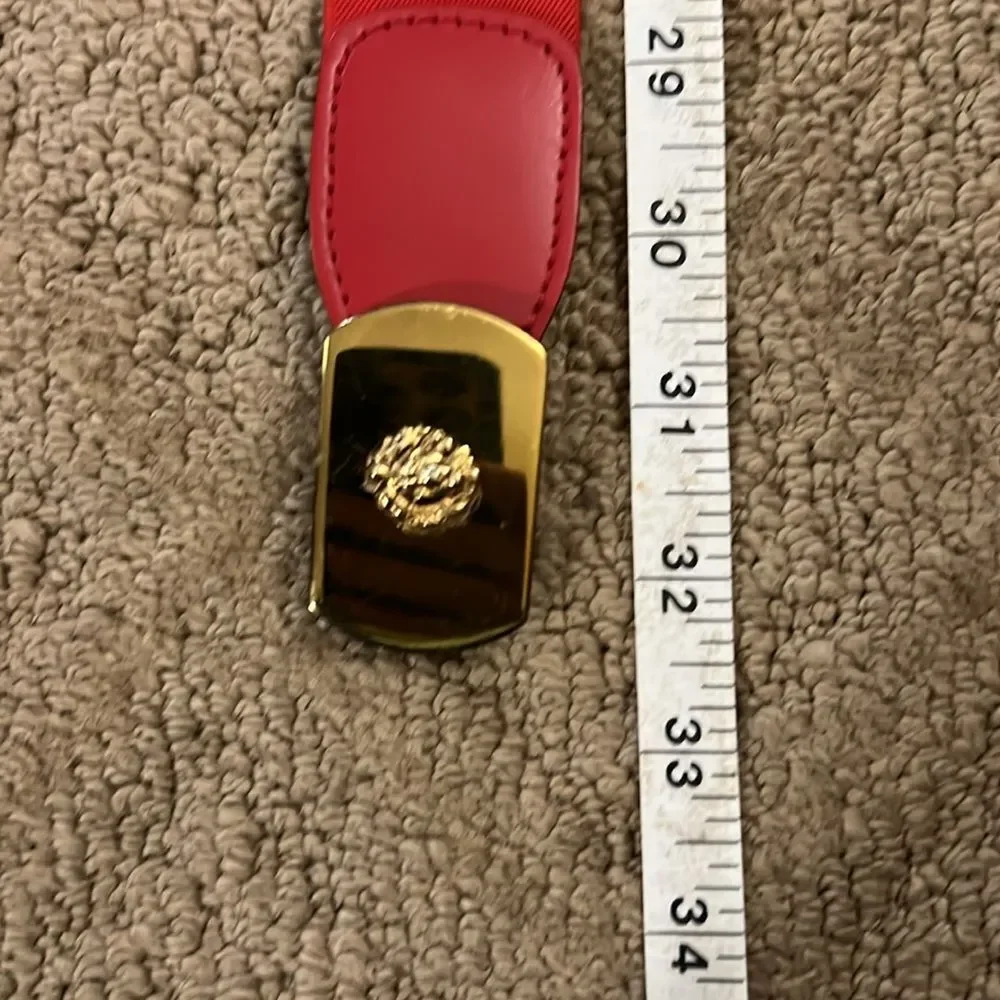 VINTAGE Anne Klein red stretch belt with gold buckle.